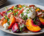 Delightful Summer Stone Fruit Salad With Prosciutto, Burrata, and a Honey Balsamic Drizzle